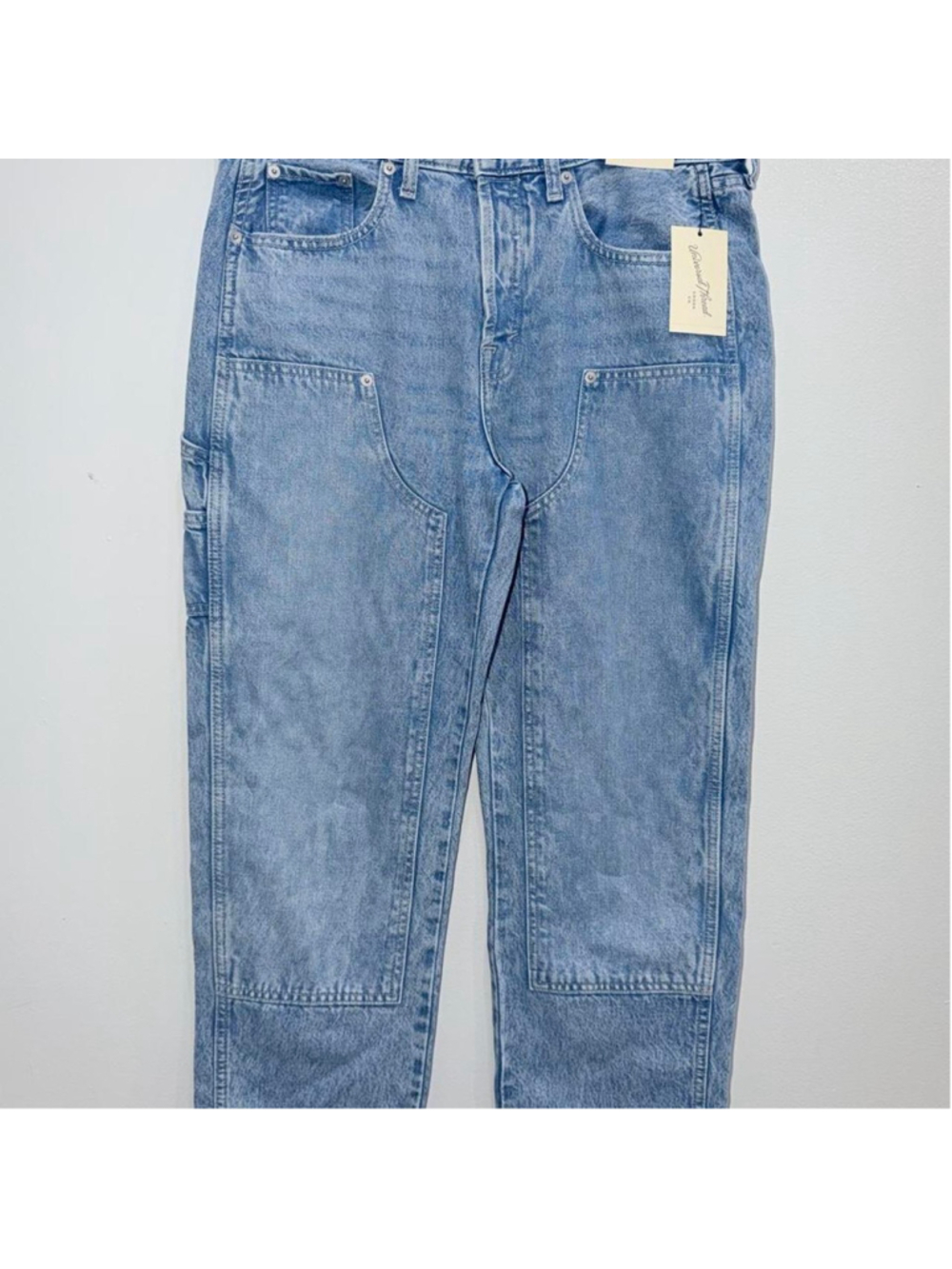 These light-wash Universal Thread utility jeans feature distinctive curved front